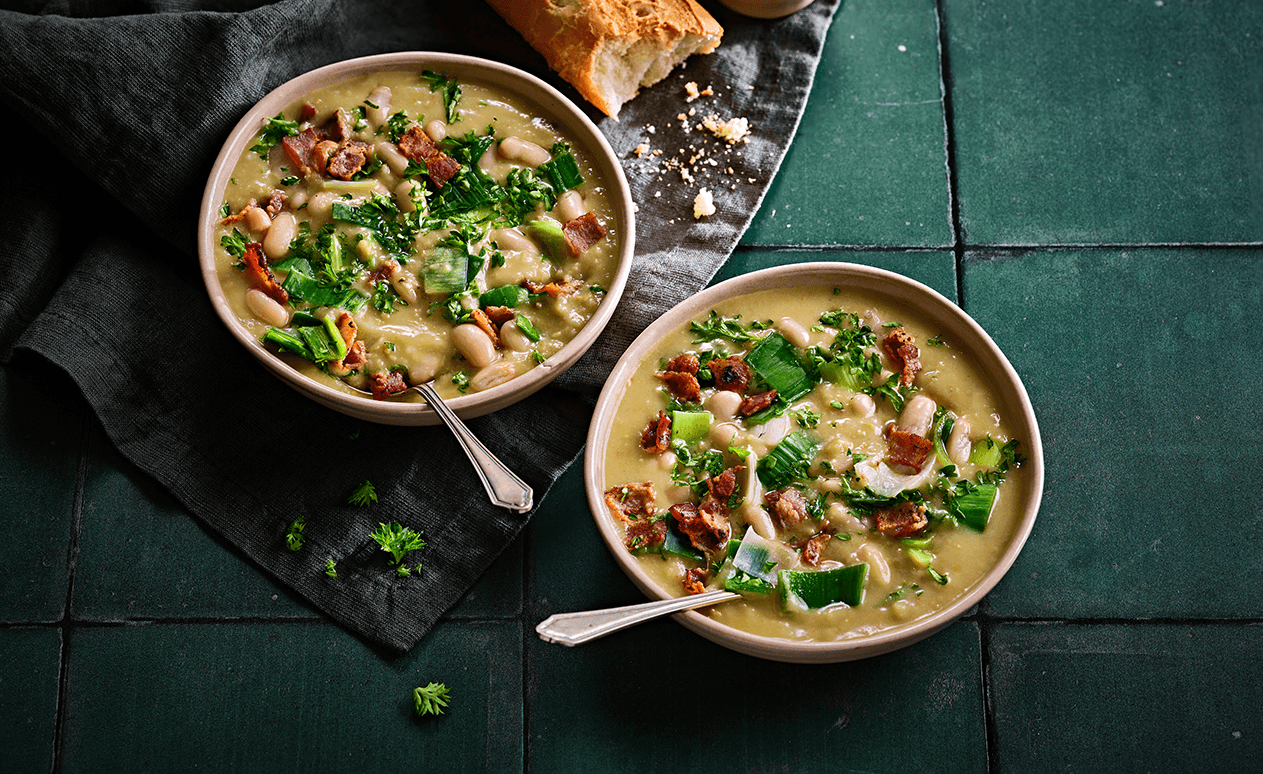 Delicious high protein soup using Finnebrogue Naked Bacon, Naked Sausage, white beans and leeks.
